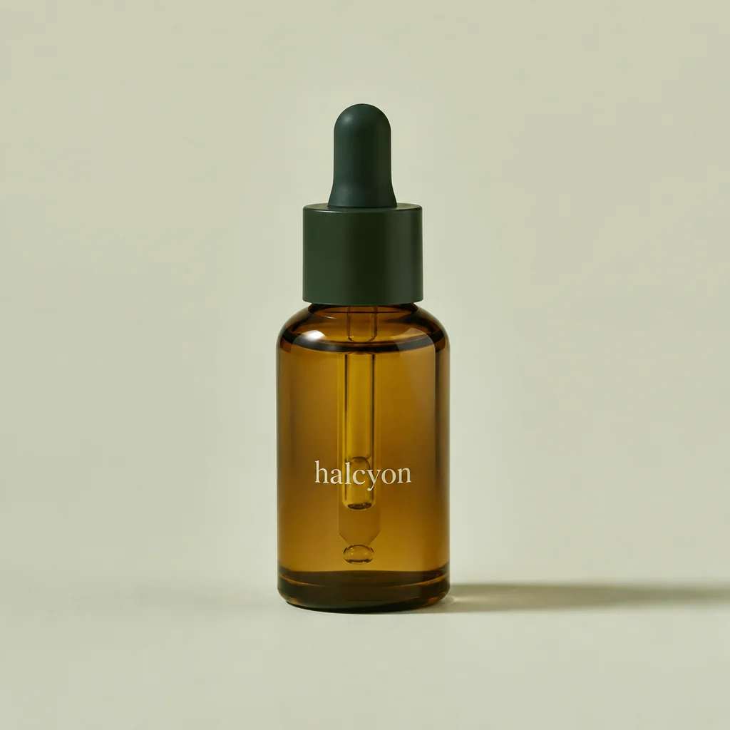Amber glass facial oil with a dark green dropper