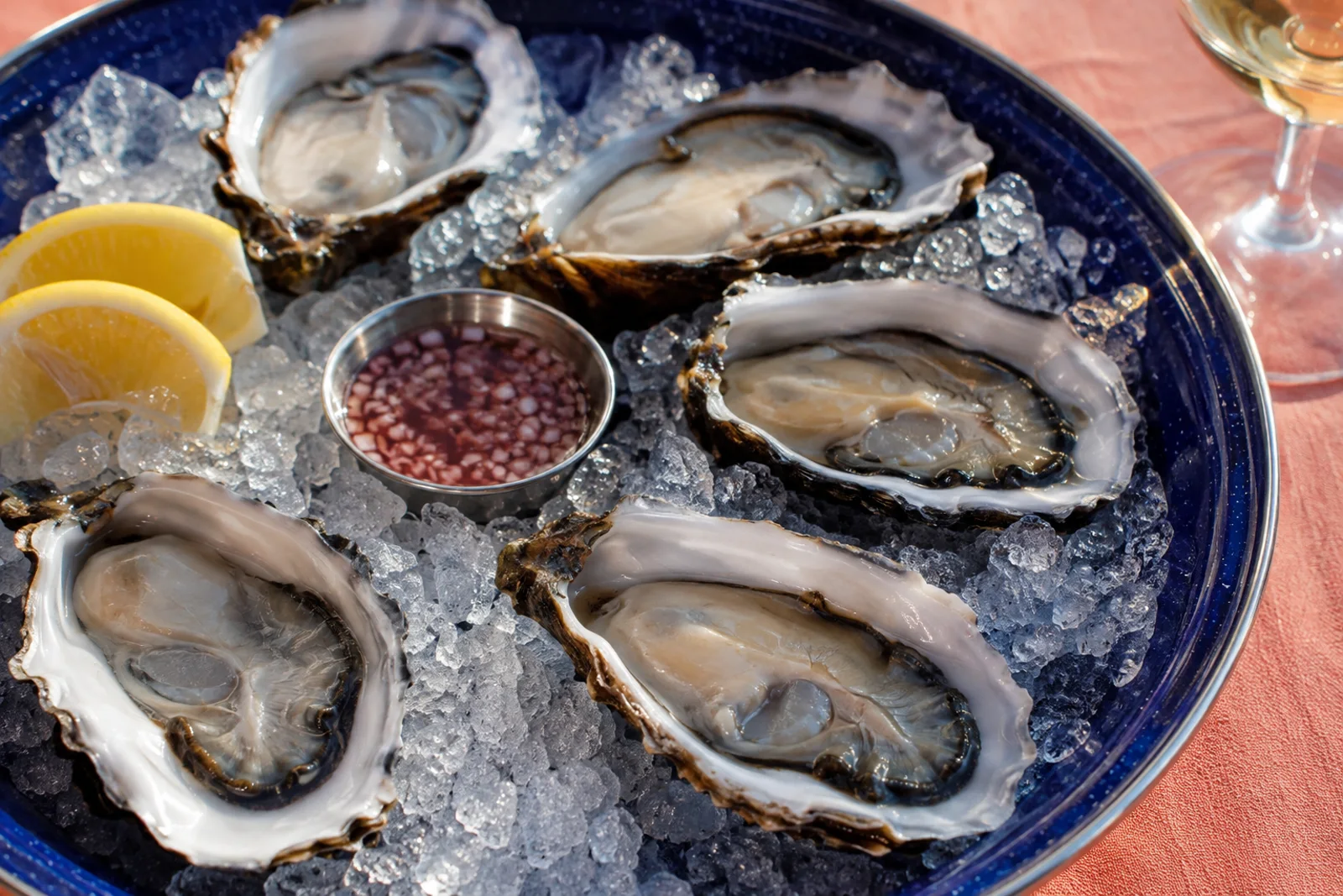 Freshly opened oysters nestled on ice.